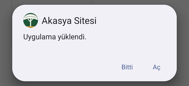 Uygulama yüklendi bildirimi, Bitti ve Aç düğmeleri.